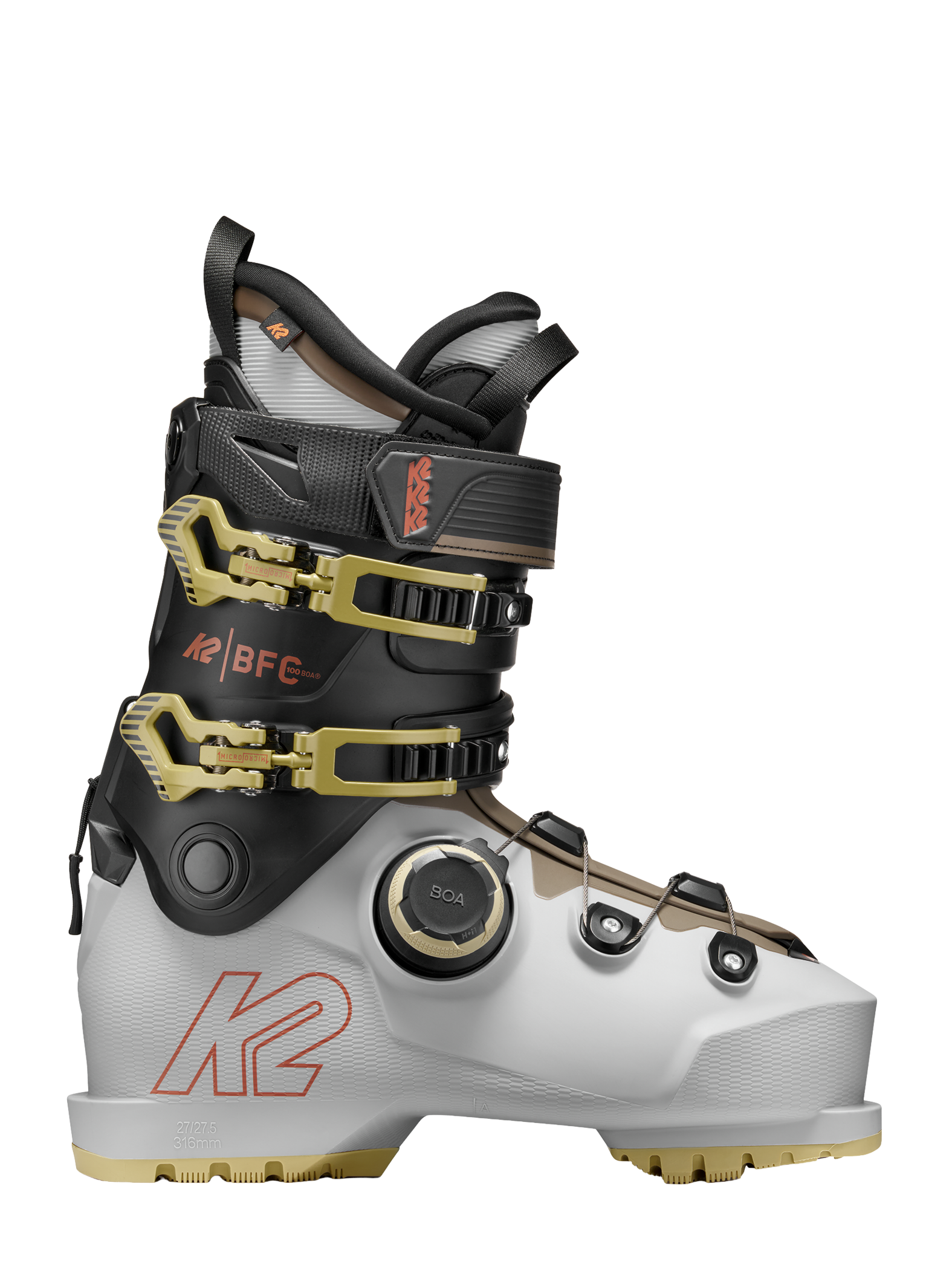 White/black BOA ski boots with gold buckles and black ankle strap