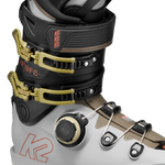 White/black BOA ski boots with gold buckles and BOA dial