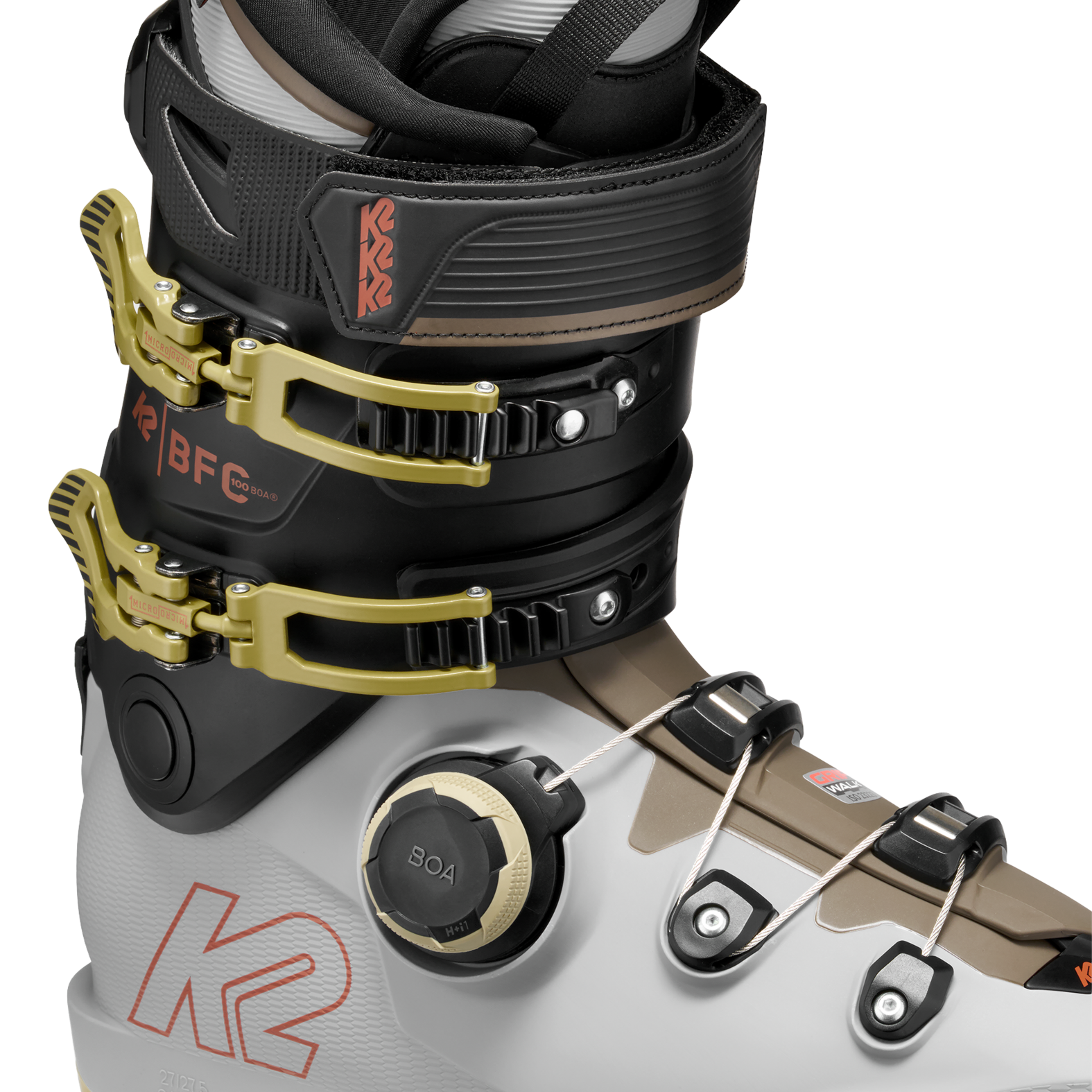 White/black BOA ski boots with gold buckles and BOA dial