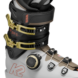 White/black BOA ski boots with gold buckles and BOA dial