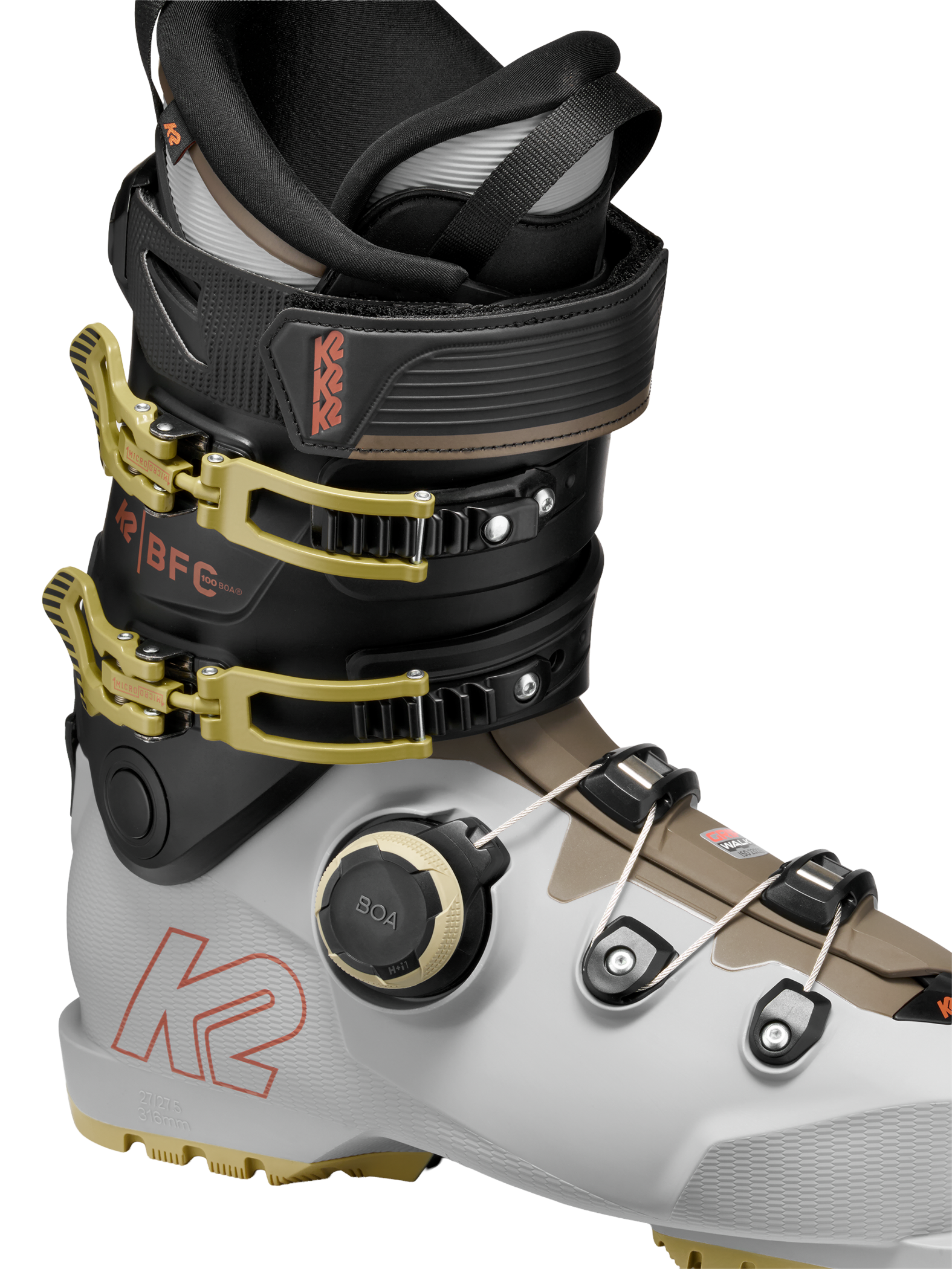 White/black BOA ski boots with gold buckles and BOA dial