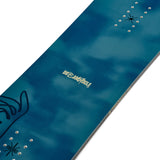 K2 Dreamsicle snowboard features a dark blue design with white graphics.