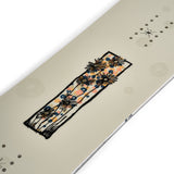 K2 Women's First Lite 2025 snowboard features a floral design on a white background.