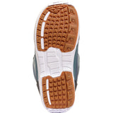 K2 Haven 2025 women's snowboard boot features a green upper with a brown heel and white sole.