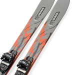 Gray skis with orange graphic streaks and mounted black bindings, angled close-up