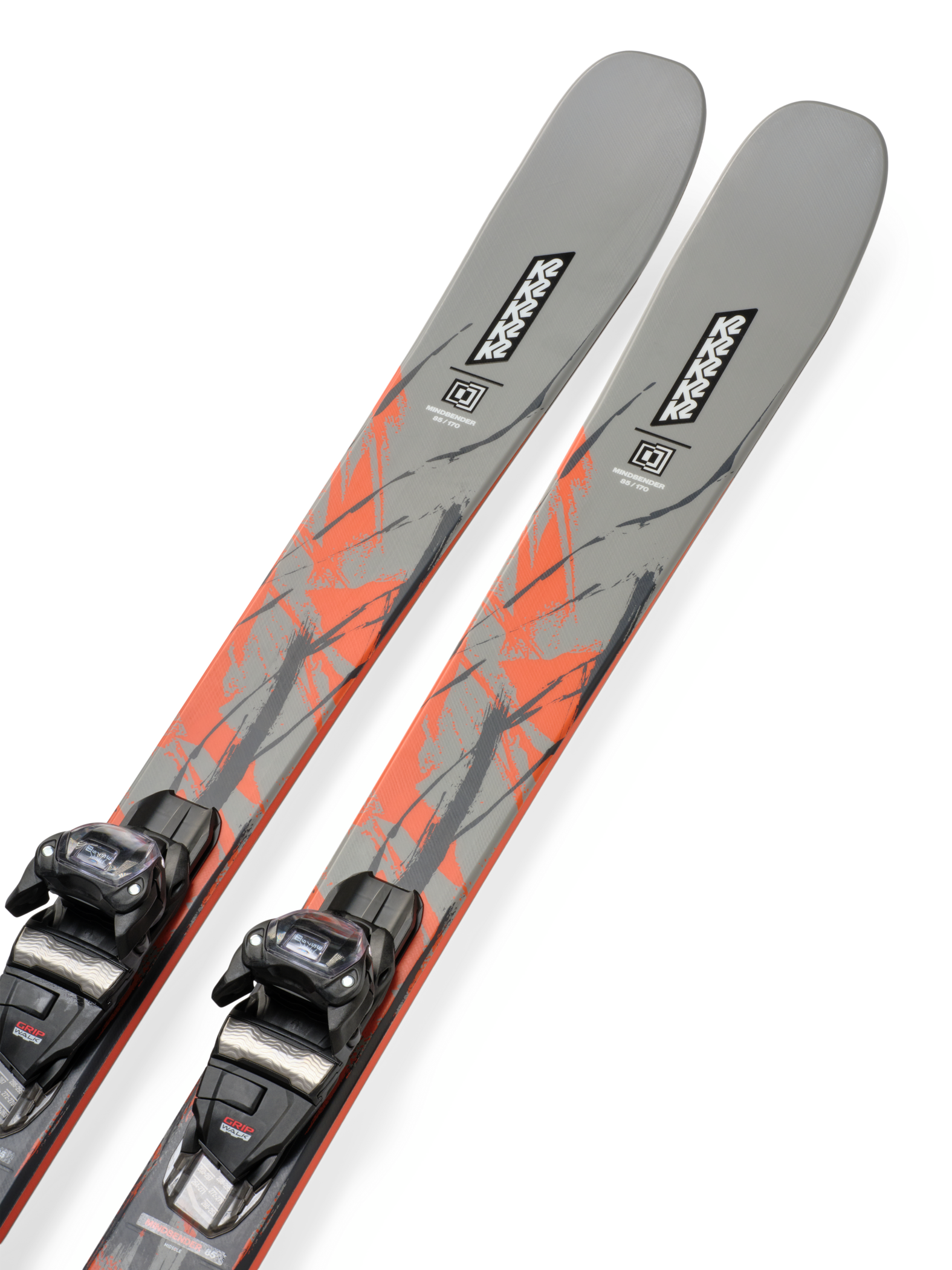 Gray skis with orange graphic streaks and mounted black bindings, angled close-up