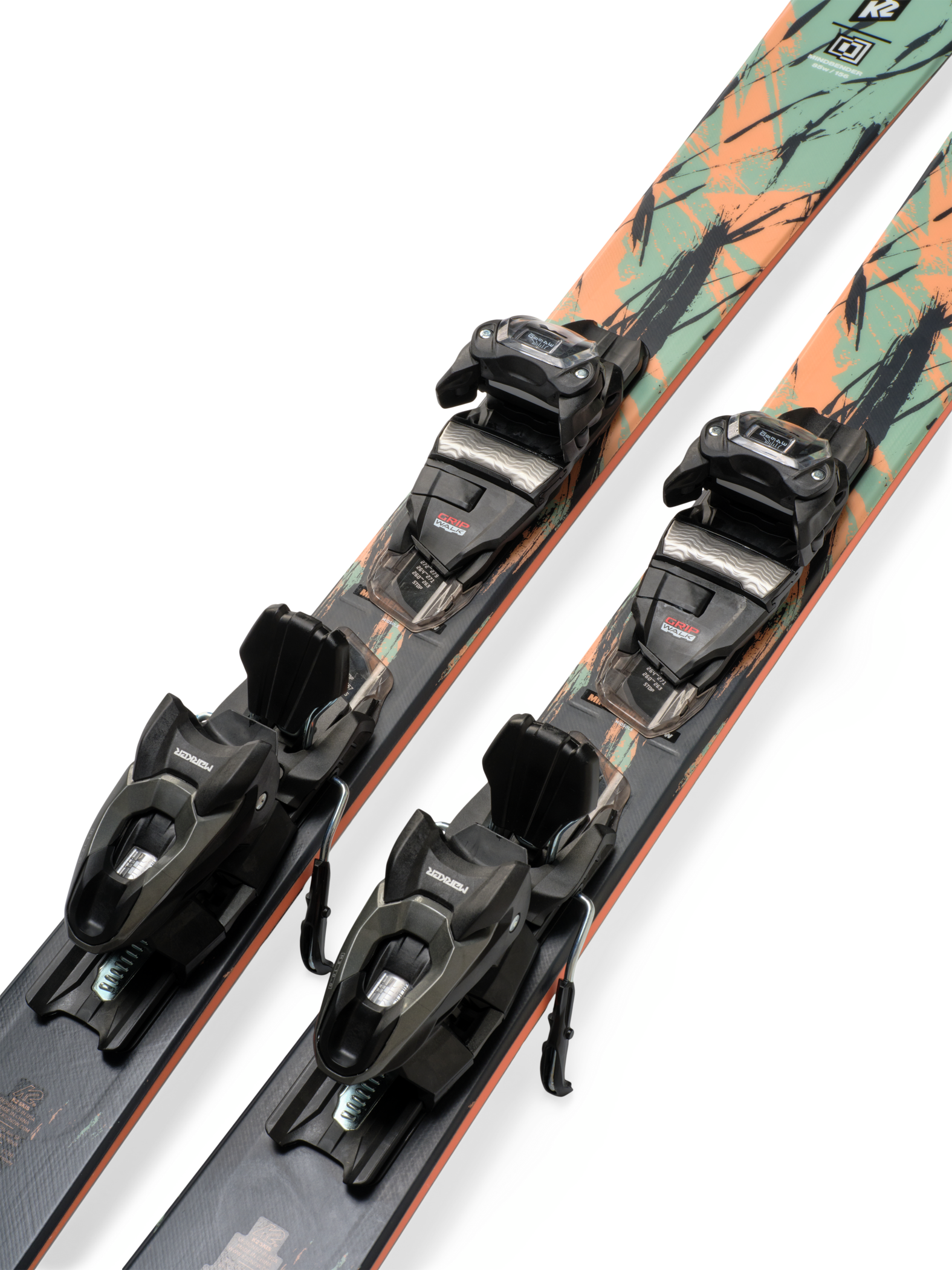 Mint skis with mounted black bindings, angled side view