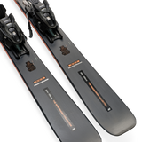 Gray ski bases with black bindings and orange-edge accents