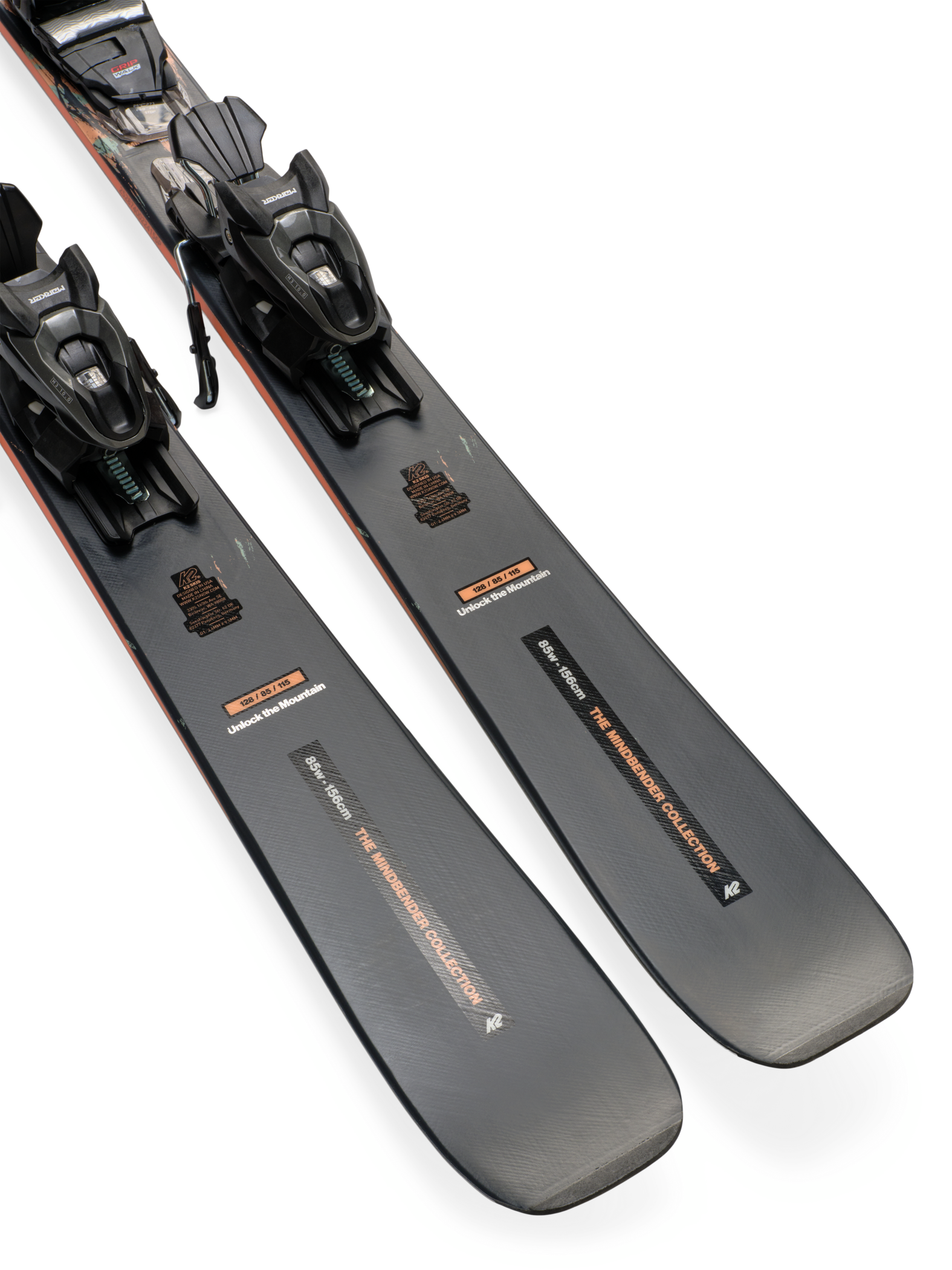 Gray ski bases with black bindings and orange-edge accents