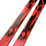 K2 Mindbender 88 skis, angled view of red top with black speckle graphics