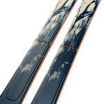 K2 Mindbender 88 skis, blue bases with orange side stripe and curved top edge