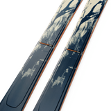 K2 Mindbender 88 skis, blue bases with orange side stripe and curved top edge