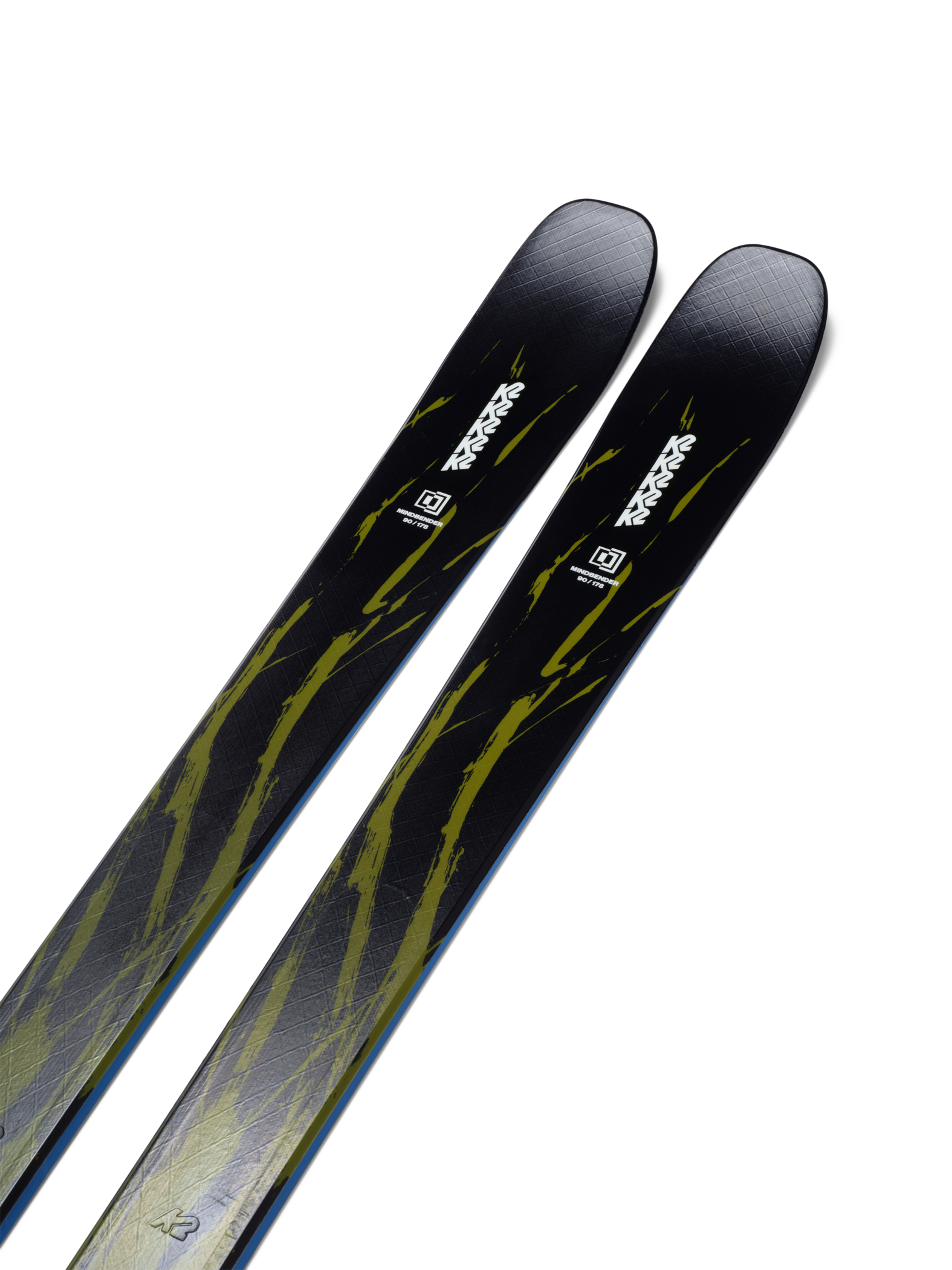 Pair of black skis with lime abstract graphics, angled top view