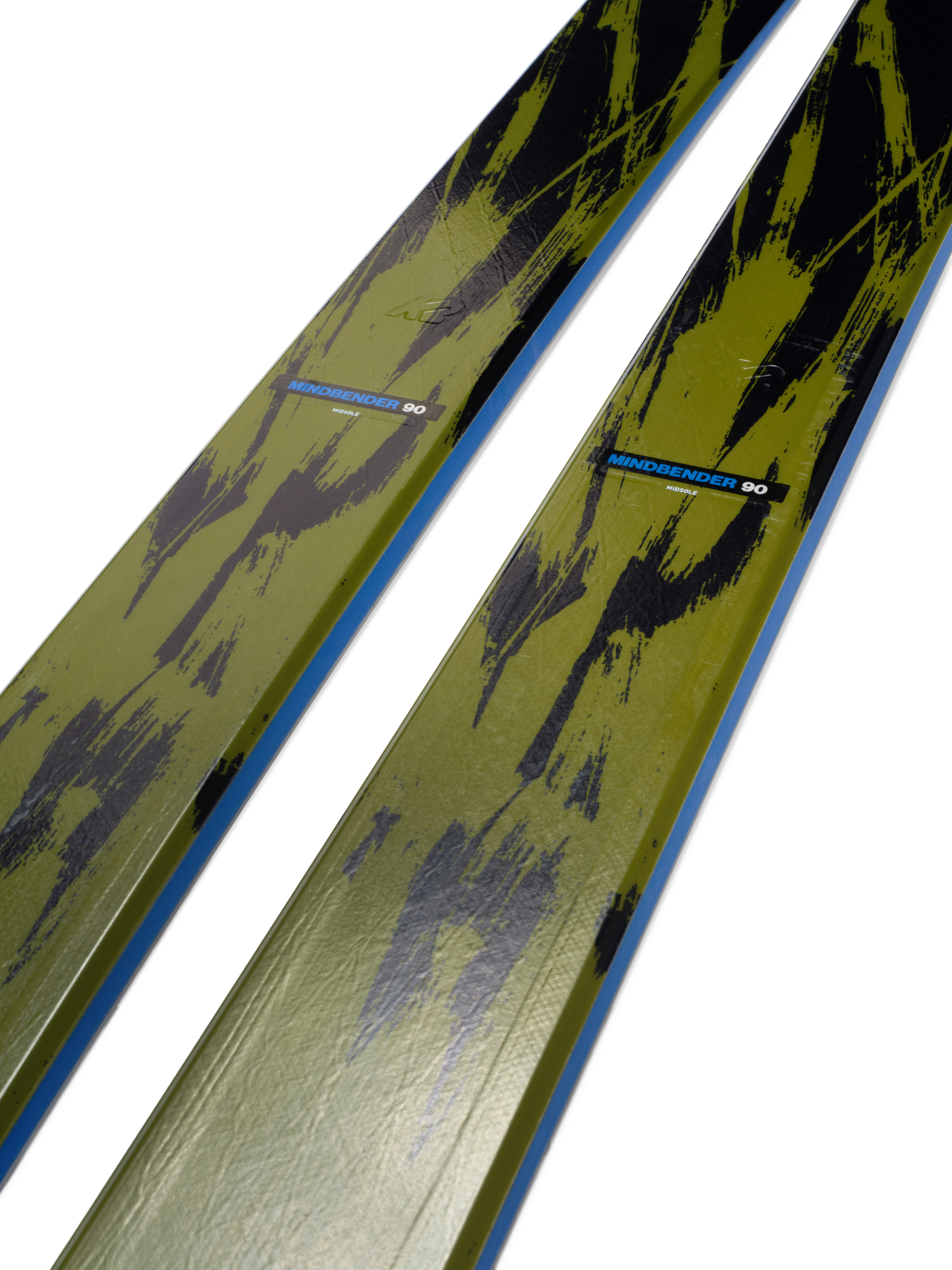 Lime-and-black skis with yellow topsheet and blue stripe, angled view
