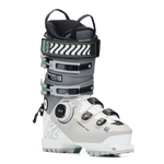 White and grey women’s ski boots with BOA dial and green buckle accents