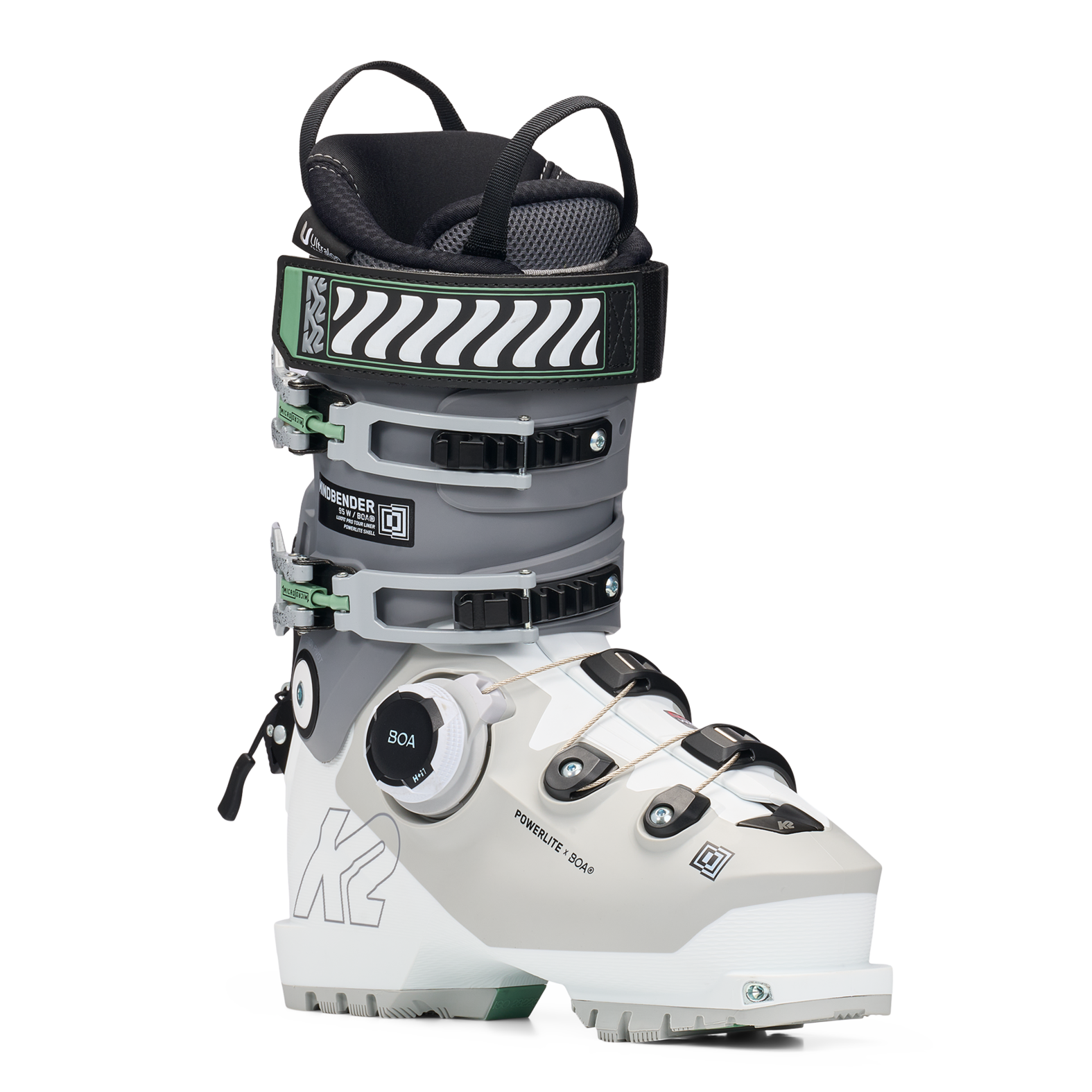 White and grey women’s ski boots with BOA dial and green buckle accents