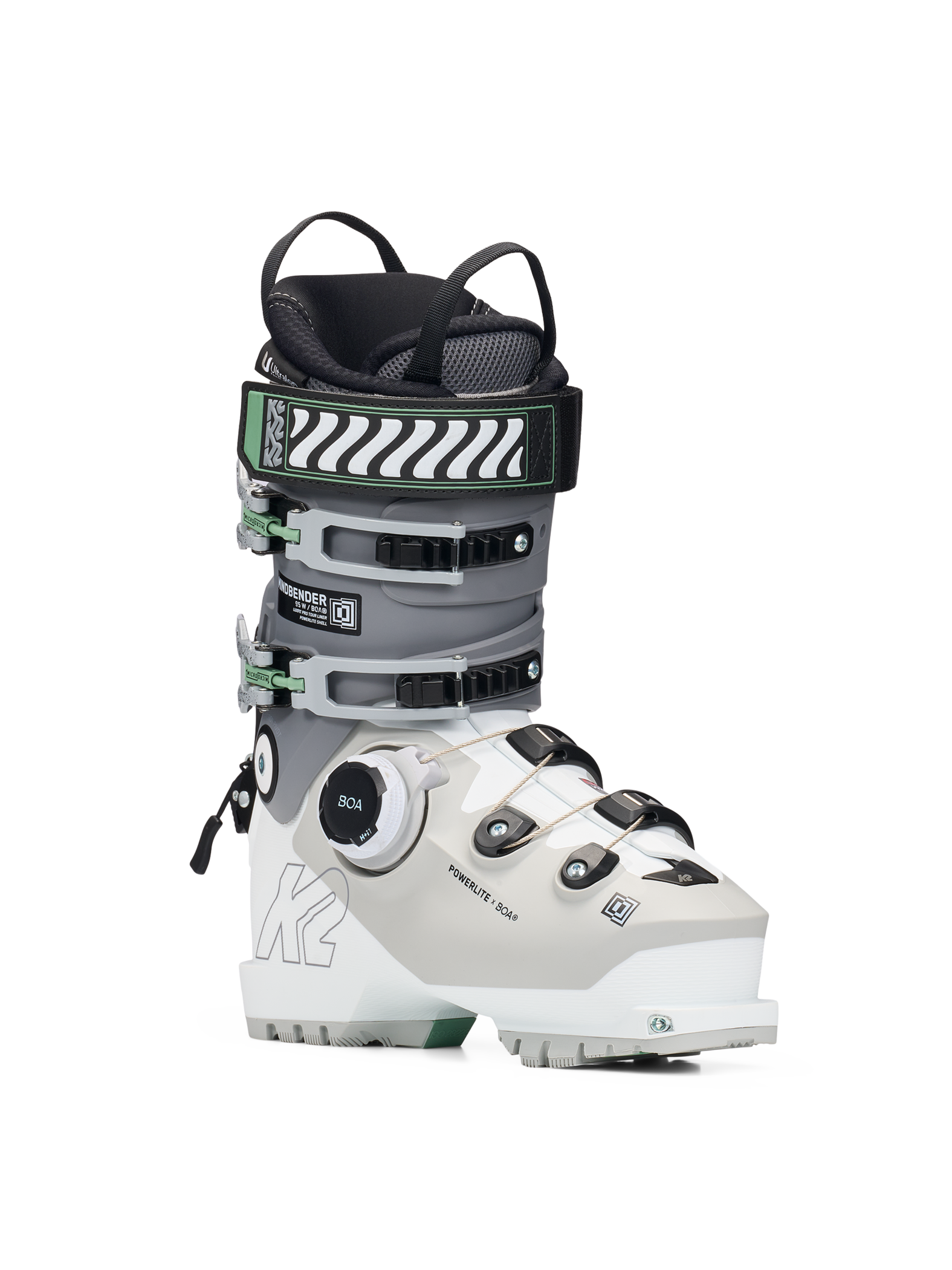 White and grey women’s ski boots with BOA dial and green buckle accents