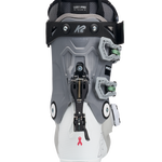 White and grey women’s ski boots with BOA dial and back strap, green details