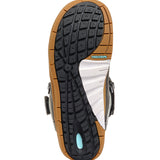 K2 Boundary snowboard boot, black and orange, features a textured sole and adjustable straps.