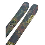 K2 Reckoner 102 skis feature a vibrant green and purple graphic design.