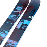 Women's blue and dark graphic twin-tip skis, angled close-up