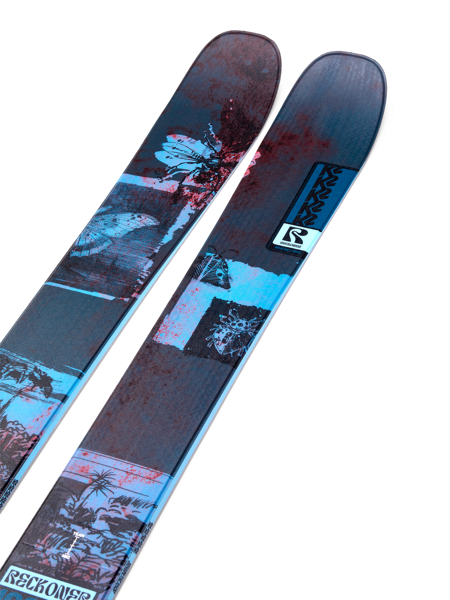 Women's blue and dark graphic twin-tip skis, angled close-up