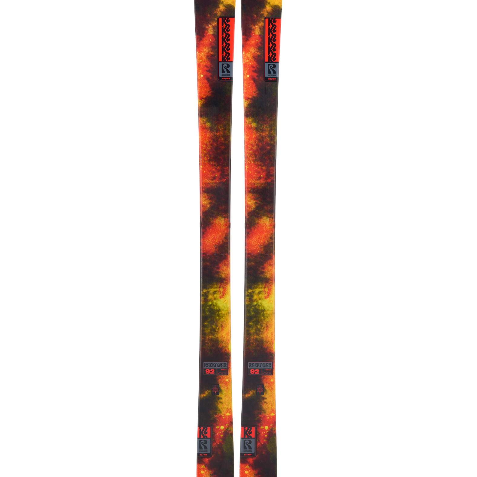 K2 Reckoner 92 skis, orange-yellow tie-dye graphic, front view.