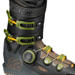 Black ski boot with neon green BOA dial, front buckles, and orange K2 logo