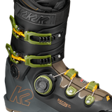 Black ski boot with neon green BOA dial, front buckles, and orange K2 logo