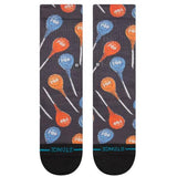 Stance Kid's Tootsie Pop Crew Sock 2024 - A pair of crew socks with a repeating pattern of blue and orange lollipops that say "POP" on them, against a dark gray background.