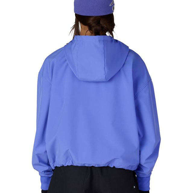 Women’s waterproof crop hoody in bright blue, hooded back view with elastic cuffs