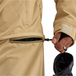 Airblaster Kook Shell Suit 2025 - A tan-colored jacket with a zippered pocket on the back, featuring a black zipper and a small white logo.