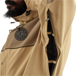 Airblaster Kook Shell Suit 2025 - Beige jacket with black zipper and logo on chest.