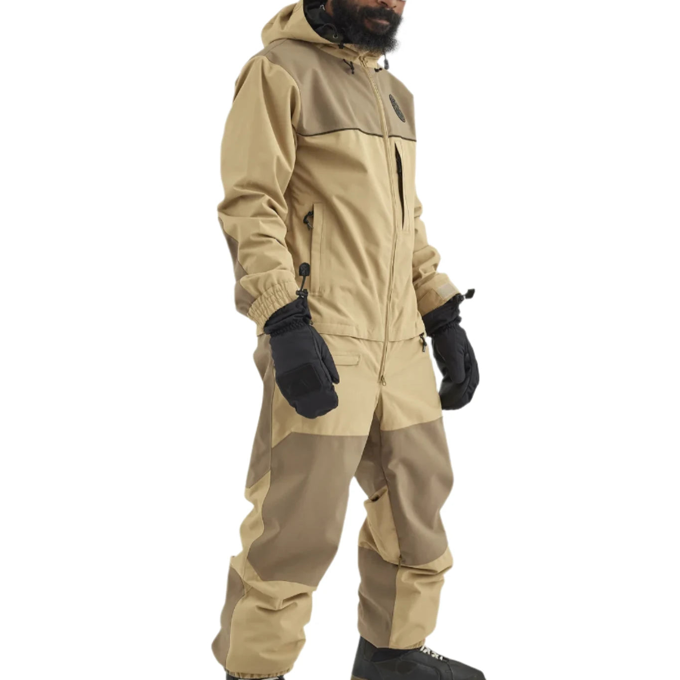 Airblaster Kook Shell Suit 2025 - A tan-colored snowsuit with a black zipper and logo on the chest.