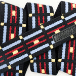 Arcade Vernon Kee Keyah Slim Belt 2025 - A black belt with a repeating pattern of red, blue, and yellow lines.