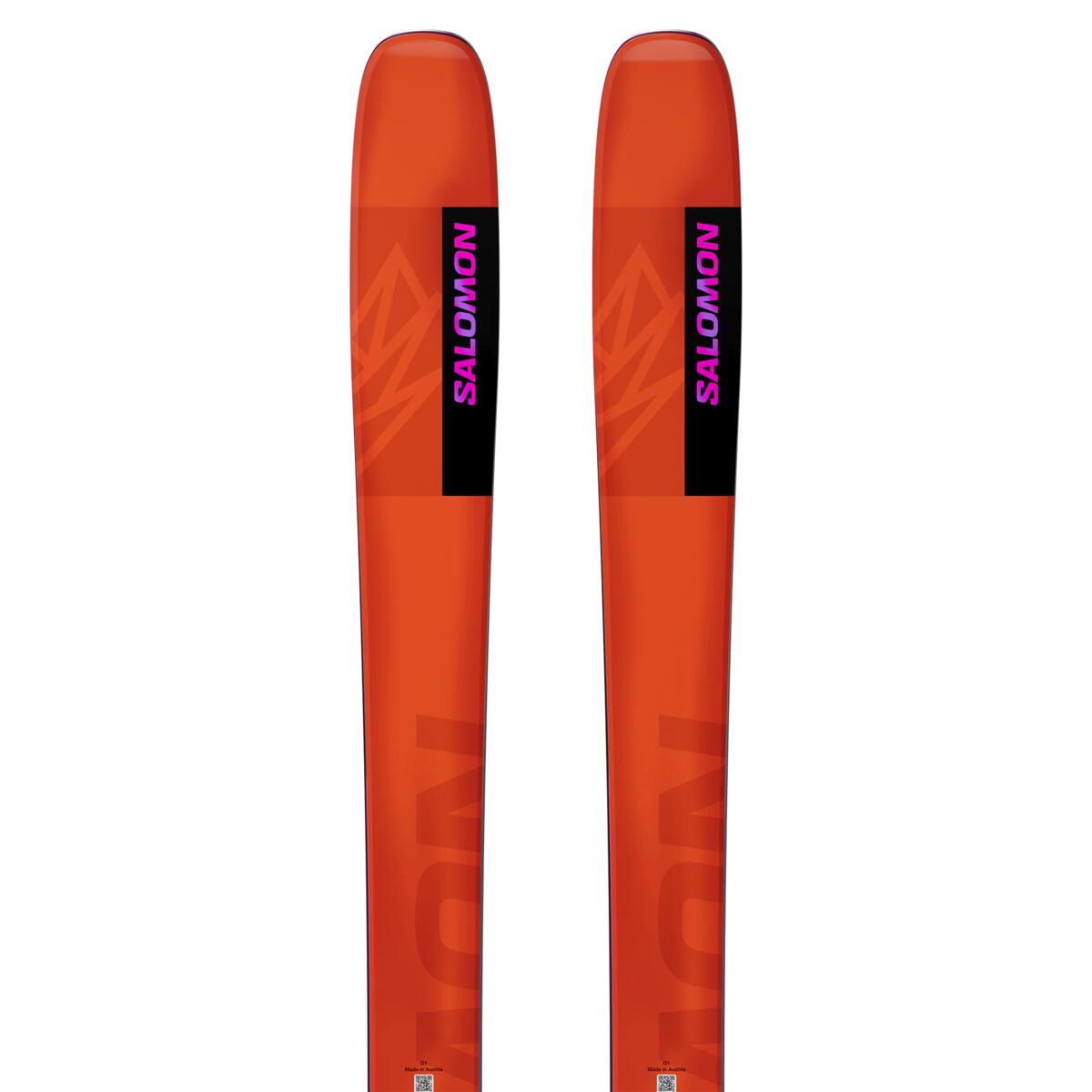 Salomon QST 106 Skis 2025 - A pair of skis with a black and orange color scheme, featuring a geometric pattern on the top sheet.