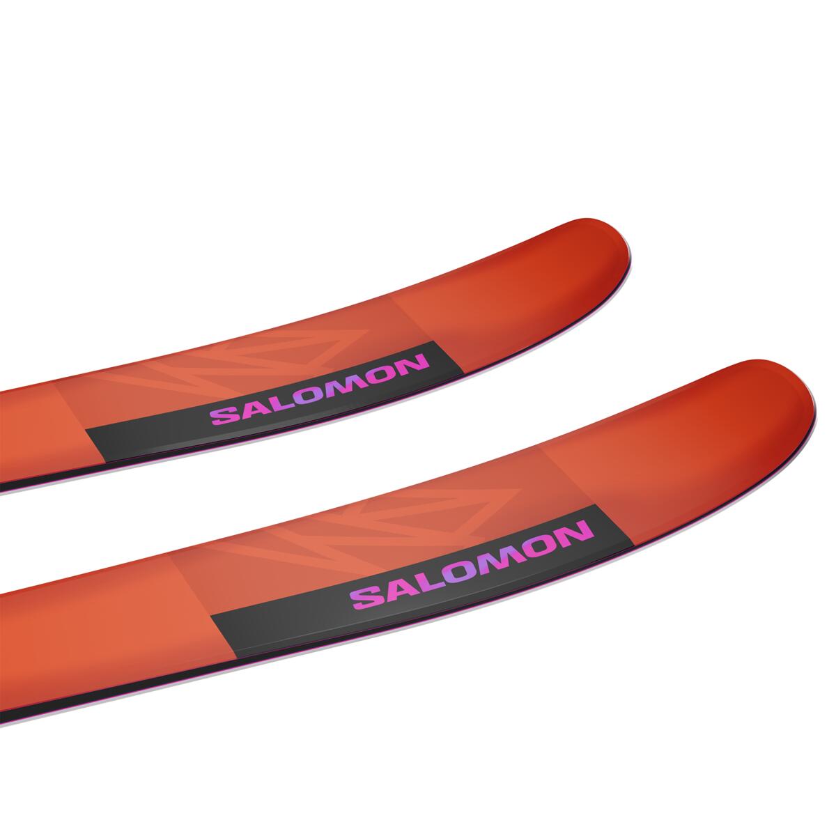 Salomon QST 106 Skis 2025 - A pair of skis with a black and orange color scheme, featuring a geometric pattern on the top sheet.