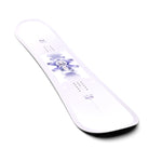 Salomon Women's Lotus Snowboard 2025 - White snowboard with purple flower graphic on top sheet.