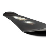 Salomon Pulse Snowboard 2025 - A black snowboard with a white logo on top and a blurry image of a person riding it in the background.