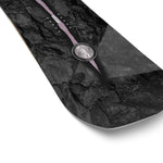 Salomon Craft Snowboard 2025 - A black snowboard with a white logo and text on top, featuring a gray background with a faint pattern of lines and shapes.