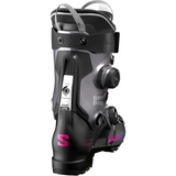 Salomon Women's Supra 115 Dual BOA Ski Boot - A black ski boot with a silver logo on the side and a pink "S" on the front, featuring a BOA closure system.