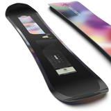 Salomon Women's Wonder Snowboard 2026 - A black snowboard with a white logo and text on top, featuring a rainbow-colored design at the bottom.