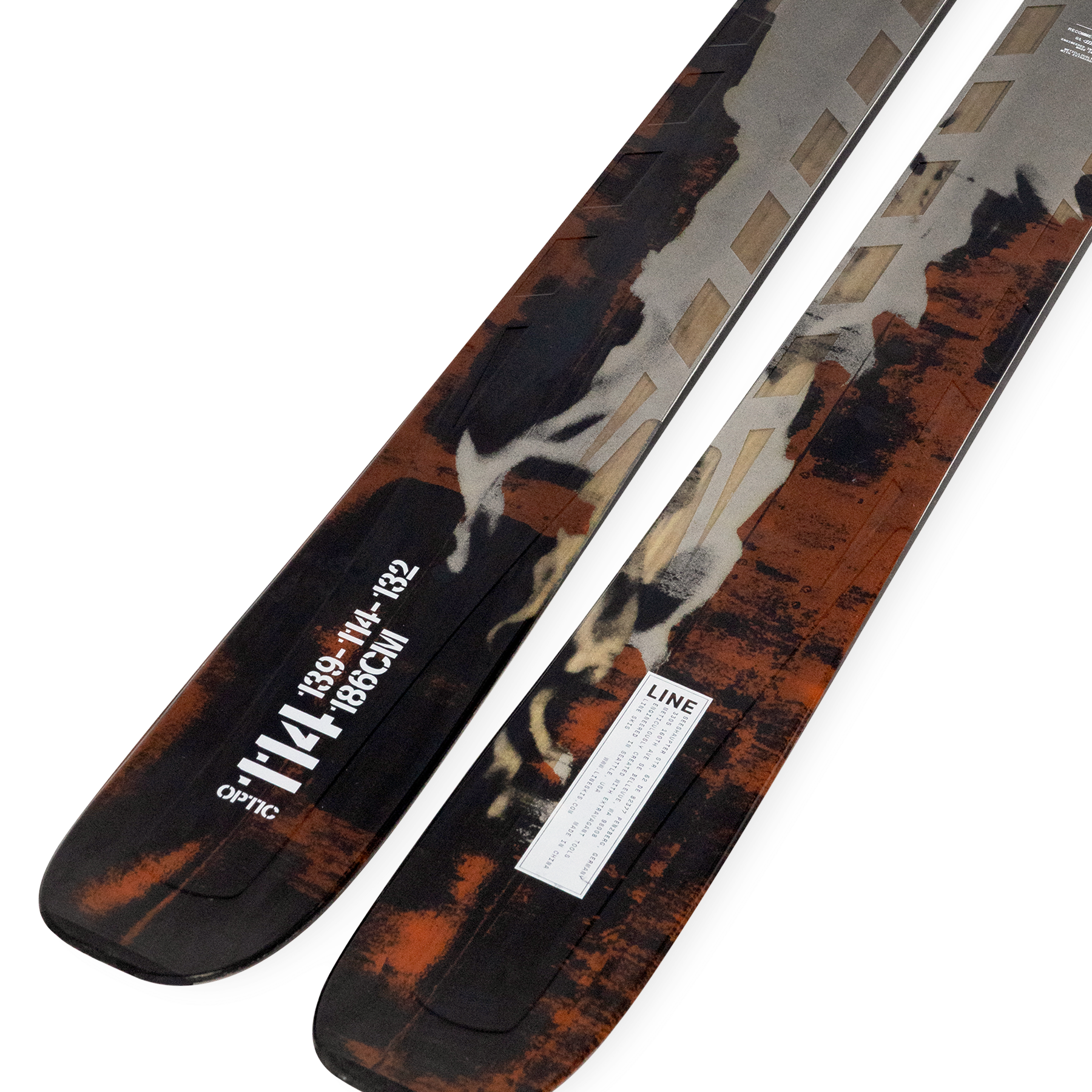 Optic 114 skis angled, orange and black camo topsheet with white logo
