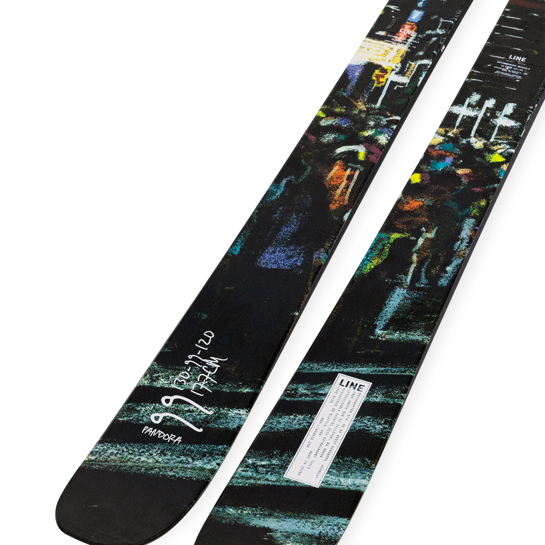 Twin-tip skis with multicolor artwork and white sidewall, dark tops, LINE