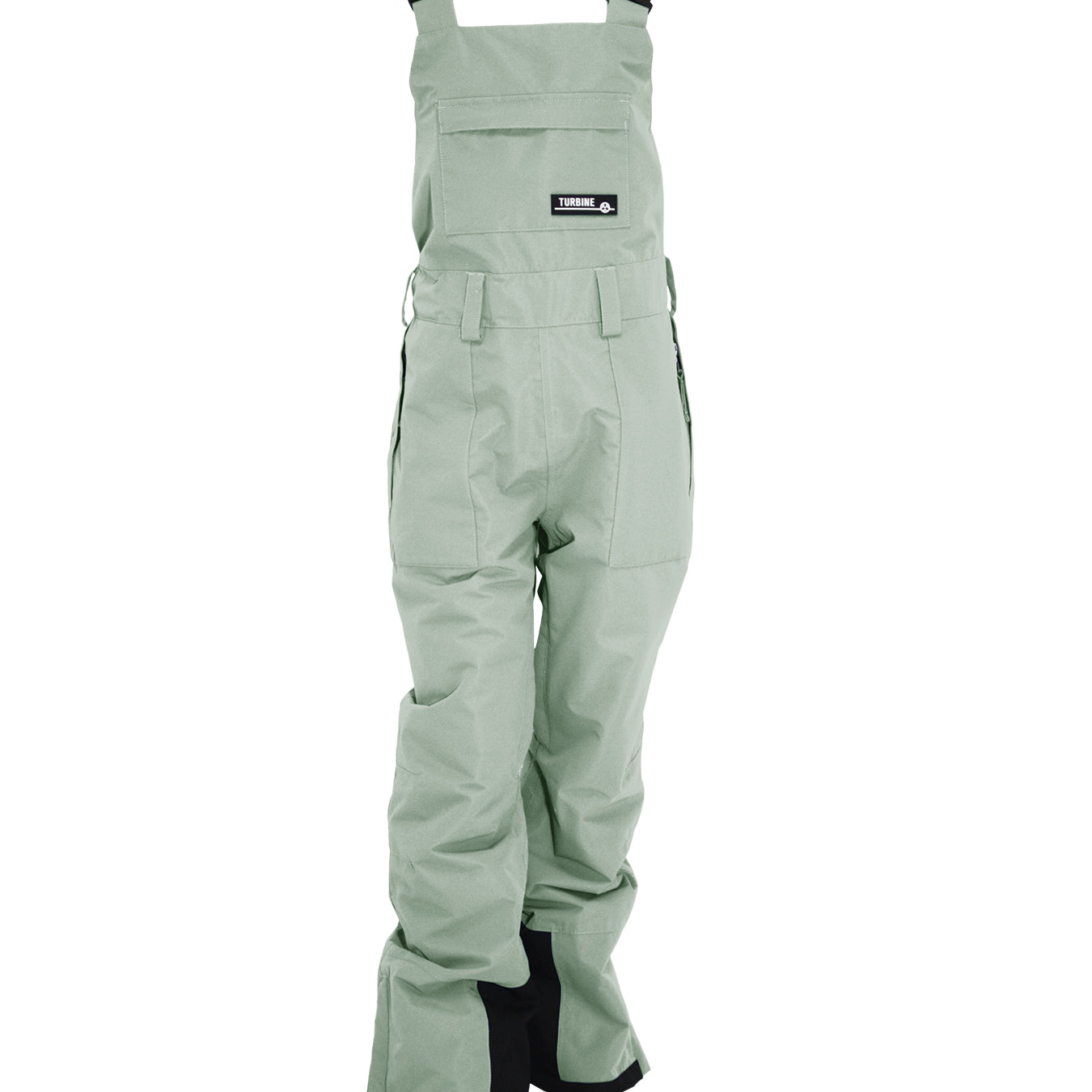 Turbine Women's Longtrail Bib 2025 - A pair of light green bib overalls with a black logo patch on the front pocket.