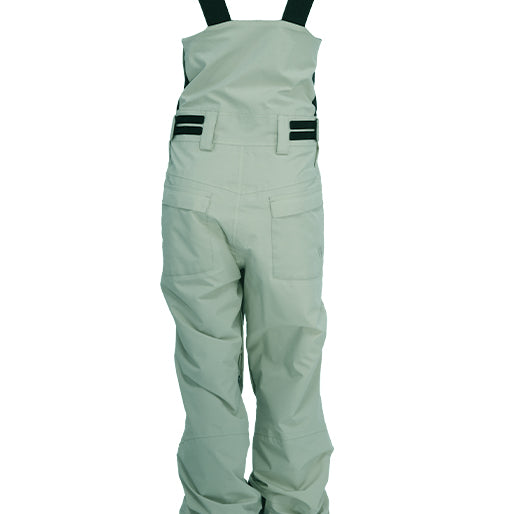 Turbine Women's Longtrail Bib - A pair of light green snow bibs with black straps and buckles, featuring a small pocket on the right side.