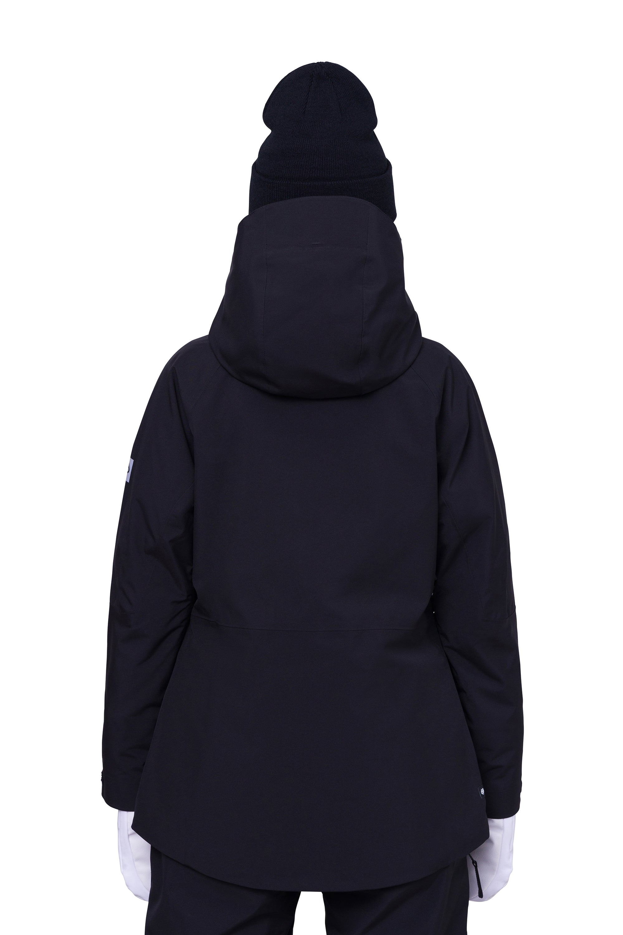 The 686 Woman's Hydra Insulated Jacket 2025 is dark navy blue with a high collar and a large hood.