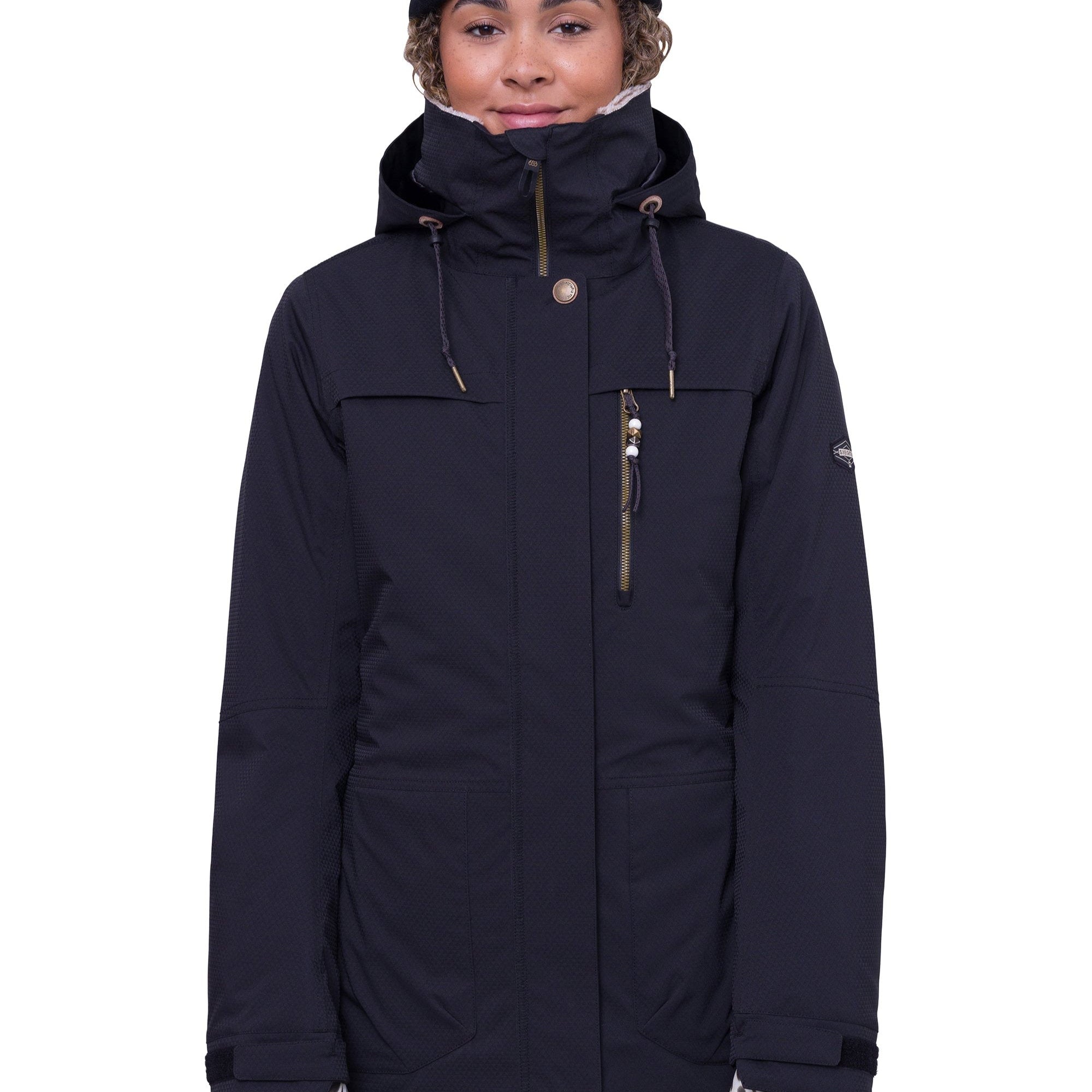 The 686 Women's Spirit Insulated Jacket in black has an insulated hood and gold zipper.