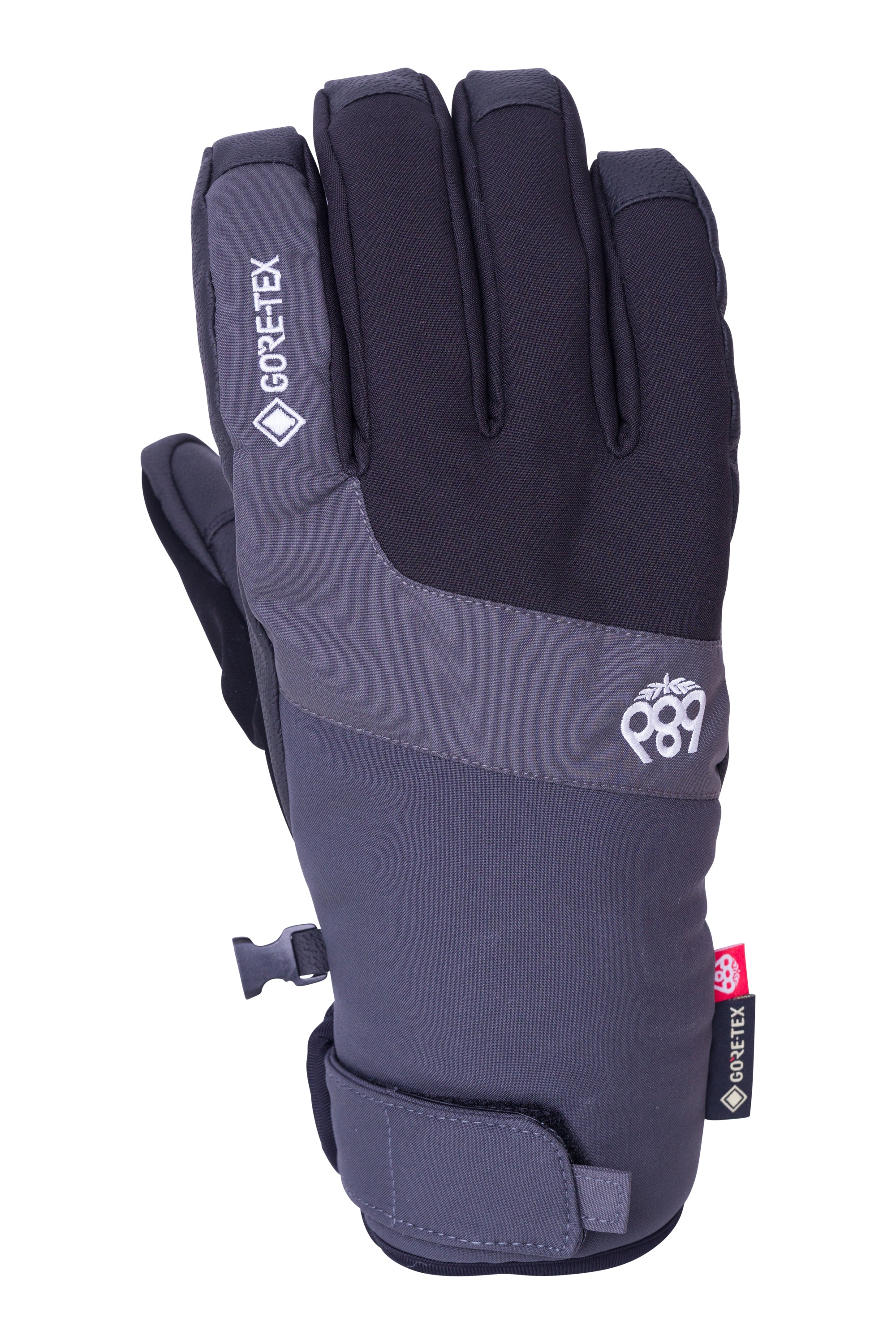 A black and gray glove with a red tag on the wrist strap, featuring the brand "GORE-TEX" and the model number "Linear Under Cuff Glove", as seen from the side view.