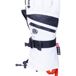 The white and black 686 glove has a zippered cuff and a strap on the back.
